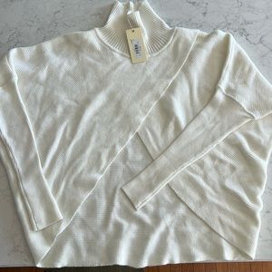 White cross front sweater